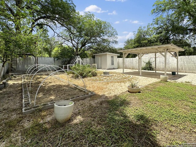 737 N Central, New Braunfels, TX 78130 - fenced backyard featuring a storage shed and a patio