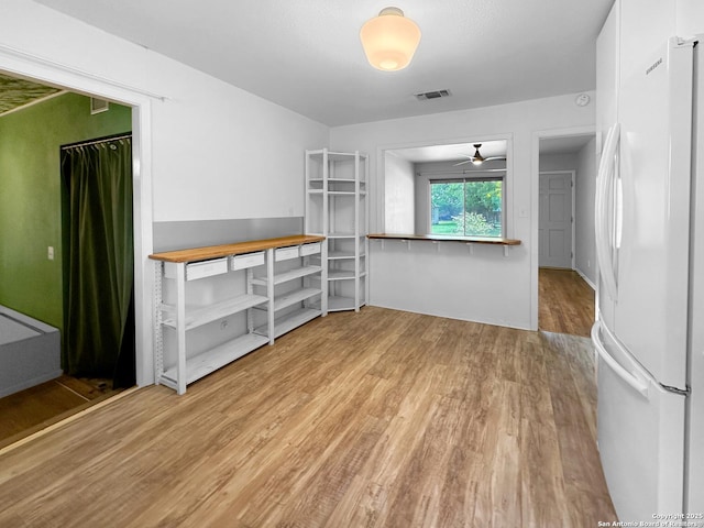 737 N Central, New Braunfels, TX 78130 - unfurnished dining area featuring wood finished floors and ceiling fan