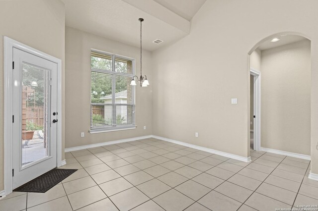 8503 Kallison Arbor, San Antonio, TX 78254 - unfurnished dining area with light tile patterned floors, arched walkways, and a chandelier
