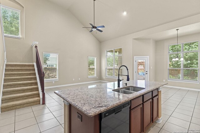 8503 Kallison Arbor, San Antonio, TX 78254 - kitchen with dishwashing machine, light tile patterned floors, open floor plan, a ceiling fan, and high vaulted ceiling