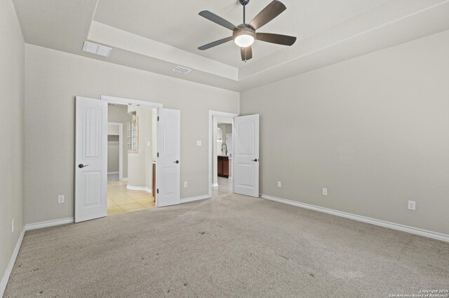 8503 Kallison Arbor, San Antonio, TX 78254 - unfurnished bedroom with light carpet, a tray ceiling, and ensuite bathroom