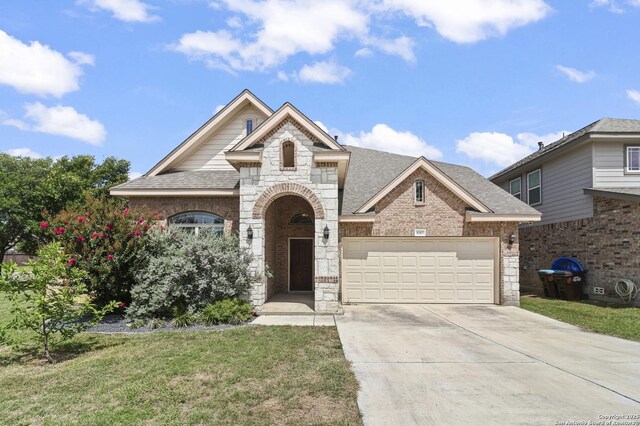 8503 Kallison Arbor, San Antonio, TX 78254 - french country home featuring brick siding, roof with shingles, driveway, a garage, and a front yard