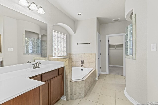 8503 Kallison Arbor, San Antonio, TX 78254 - bathroom with vanity, a bath, tile patterned floors, and a spacious closet