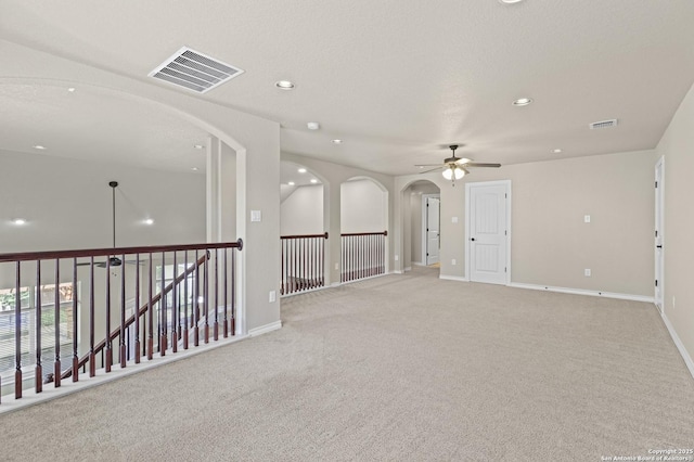 8503 Kallison Arbor, San Antonio, TX 78254 - spare room with ceiling fan, arched walkways, light colored carpet, and recessed lighting