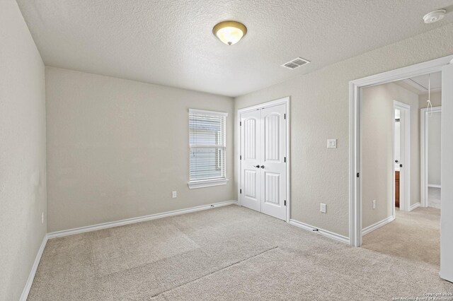 8503 Kallison Arbor, San Antonio, TX 78254 - unfurnished bedroom with carpet flooring, a textured ceiling, and a closet