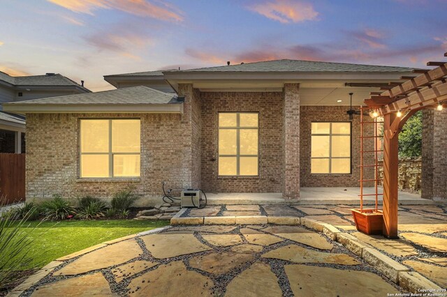 8503 Kallison Arbor, San Antonio, TX 78254 - back of house featuring brick siding, a patio area, a shingled roof, and a pergola