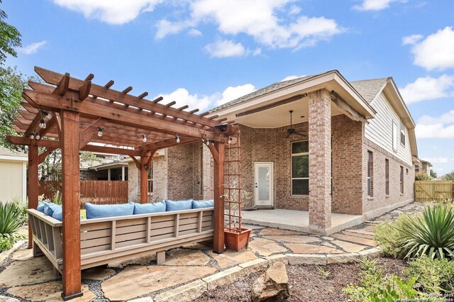 8503 Kallison Arbor, San Antonio, TX 78254 - back of house with outdoor lounge area, brick siding, a ceiling fan, a patio, and a pergola