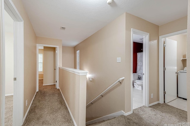 16102 Barrell Run, San Antonio, TX 78247 - corridor with an upstairs landing, carpet floors, and washer / dryer
