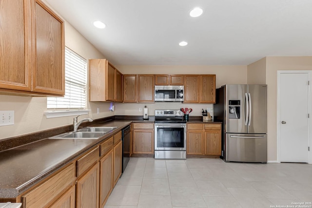 16102 Barrell Run, San Antonio, TX 78247 - kitchen featuring appliances with stainless steel finishes, dark countertops, recessed lighting, and brown cabinets