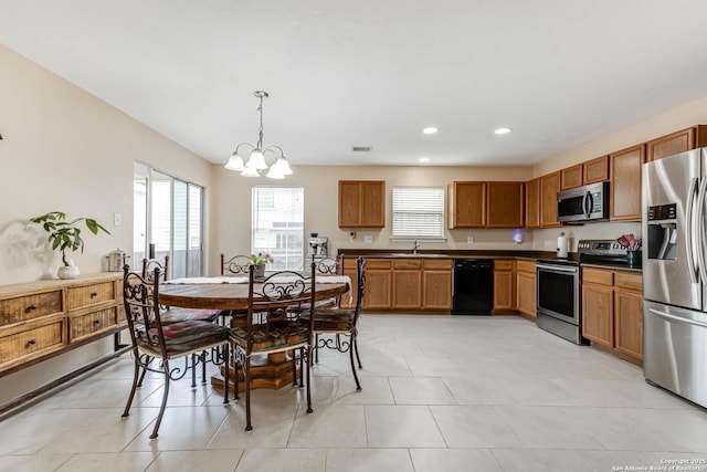 16102 Barrell Run, San Antonio, TX 78247 - kitchen with appliances with stainless steel finishes, a chandelier, pendant lighting, dark countertops, and recessed lighting