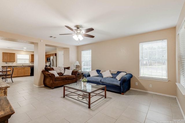 16102 Barrell Run, San Antonio, TX 78247 - living room with a ceiling fan, plenty of natural light, and light tile patterned floors