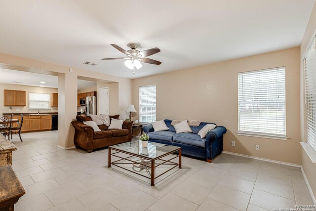 16102 Barrell Run, San Antonio, TX 78247 - living room with a ceiling fan, plenty of natural light, and light tile patterned floors