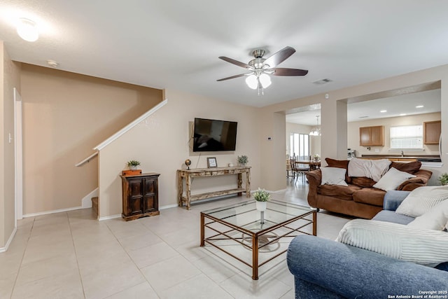 16102 Barrell Run, San Antonio, TX 78247 - living room featuring a ceiling fan, stairs, light tile patterned floors, a chandelier, and recessed lighting
