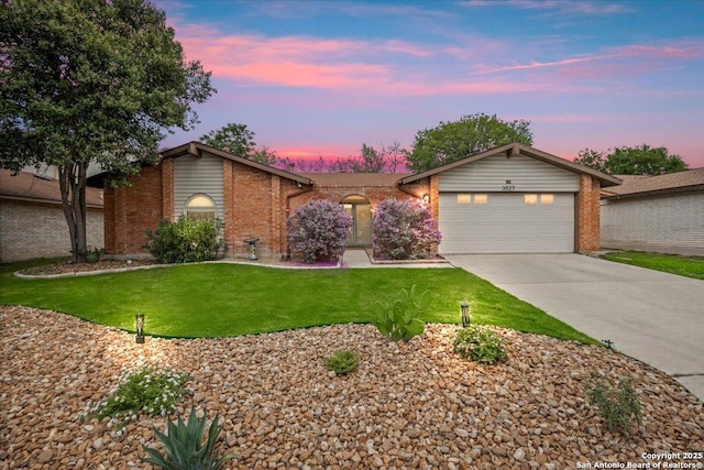 3527 Oakhorne St, San Antonio, TX 78247 - mid-century home featuring brick siding, a garage, driveway, and a front yard