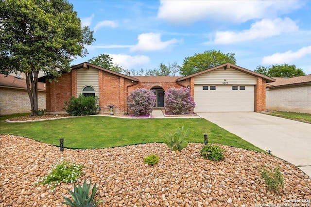 3527 Oakhorne St, San Antonio, TX 78247 - view of front of home featuring brick siding, an attached garage, driveway, and a front yard