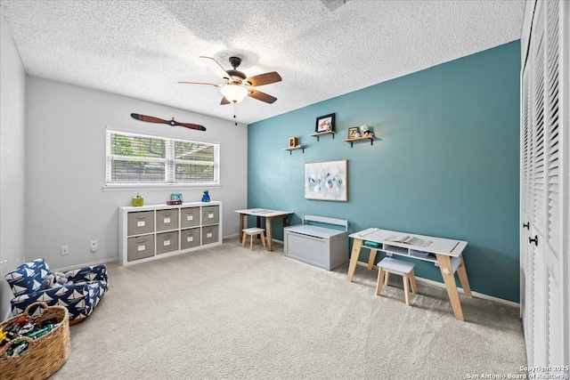 3527 Oakhorne St, San Antonio, TX 78247 - living area with ceiling fan, a textured ceiling, and carpet flooring
