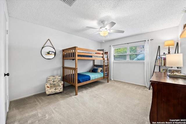 3527 Oakhorne St, San Antonio, TX 78247 - bedroom with carpet floors, a textured ceiling, and a ceiling fan