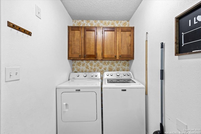 3527 Oakhorne St, San Antonio, TX 78247 - washroom featuring cabinet space, washing machine and dryer, and a textured ceiling
