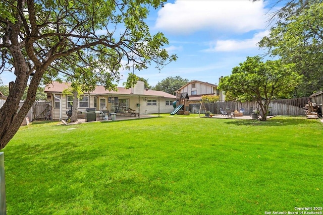 3527 Oakhorne St, San Antonio, TX 78247 - rear view of house featuring a playground, a patio area, and a fenced backyard