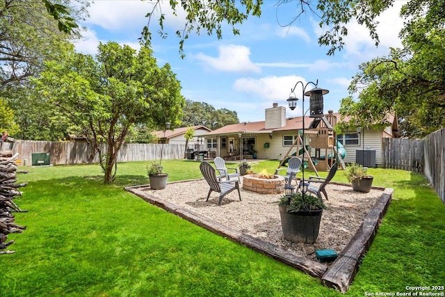 3527 Oakhorne St, San Antonio, TX 78247 - fenced backyard with a fire pit, a playground, and a patio area