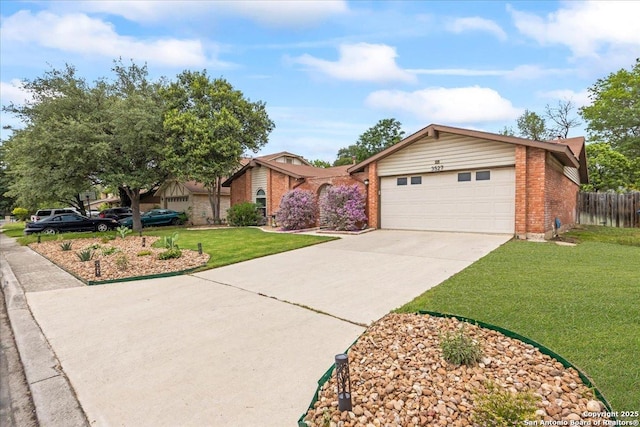 3527 Oakhorne St, San Antonio, TX 78247 - view of front of house featuring brick siding, an attached garage, and driveway