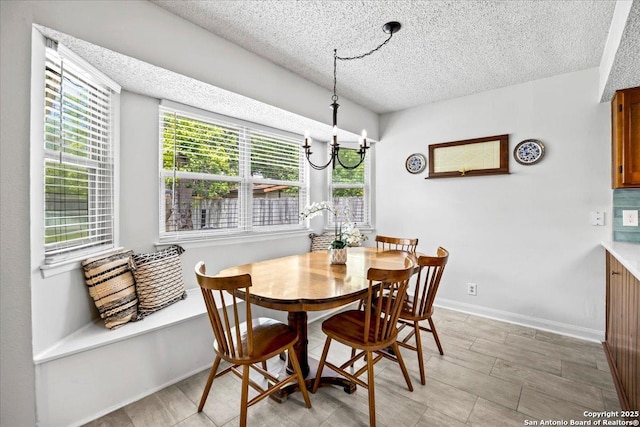 3527 Oakhorne St, San Antonio, TX 78247 - dining room with a textured ceiling and a chandelier