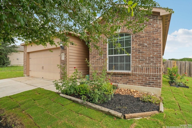 6123 Foster Ml, San Antonio, TX 78222 - view of front of home featuring brick siding, a garage, and concrete driveway