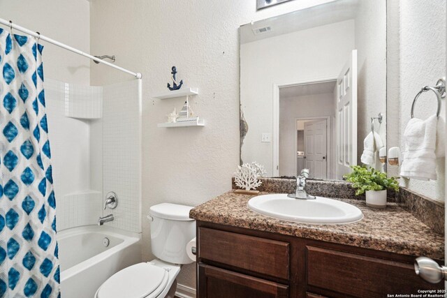 6123 Foster Ml, San Antonio, TX 78222 - bathroom featuring vanity, shower / tub combo, and a textured wall