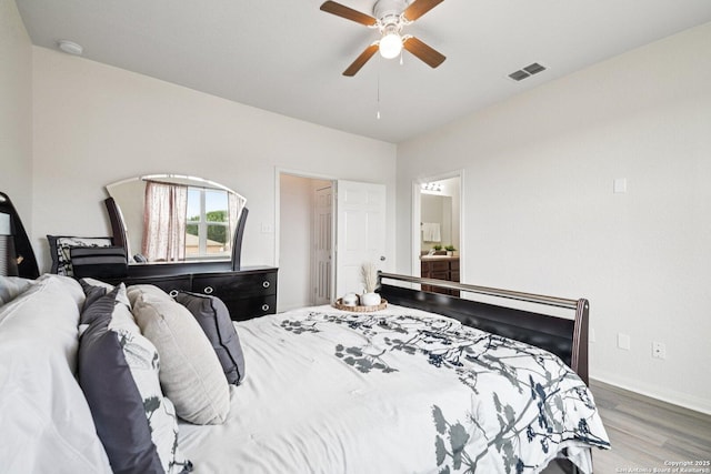 6123 Foster Ml, San Antonio, TX 78222 - bedroom with wood finished floors, a ceiling fan, and ensuite bath