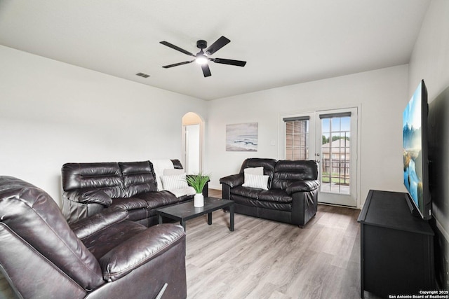 6123 Foster Ml, San Antonio, TX 78222 - living room featuring wood finished floors, arched walkways, and a ceiling fan