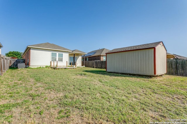 4310 Loring, Converse, TX 78109 - rear view of house featuring a storage shed and a fenced backyard