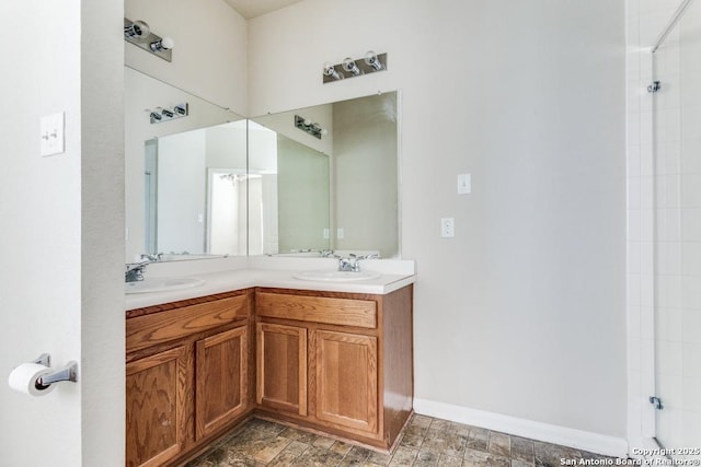 4310 Loring, Converse, TX 78109 - bathroom featuring double vanity and baseboards