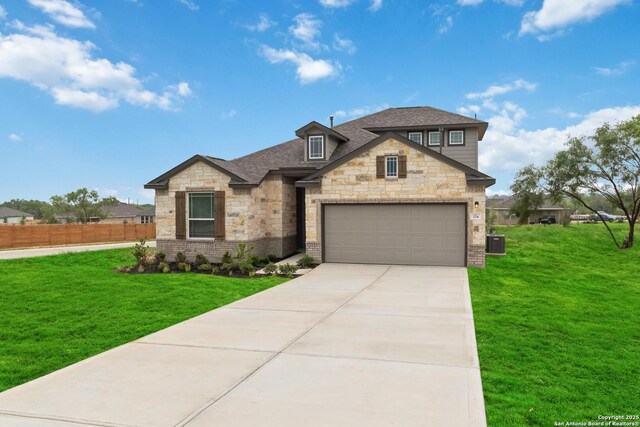 1619 Vista View Dr, Pleasanton, TX 78064 - view of front of property featuring stone siding, concrete driveway, a garage, and roof with shingles