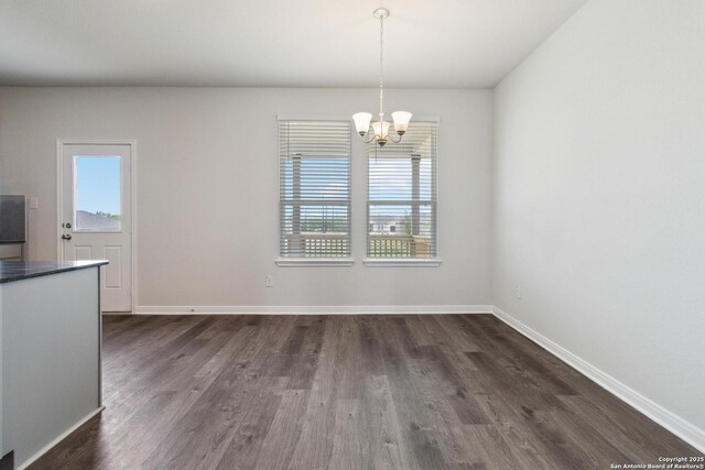 1619 Vista View Dr, Pleasanton, TX 78064 - unfurnished dining area featuring a chandelier, healthy amount of natural light, and dark wood-style flooring