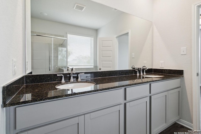 1619 Vista View Dr, Pleasanton, TX 78064 - full bath featuring double vanity and a stall shower
