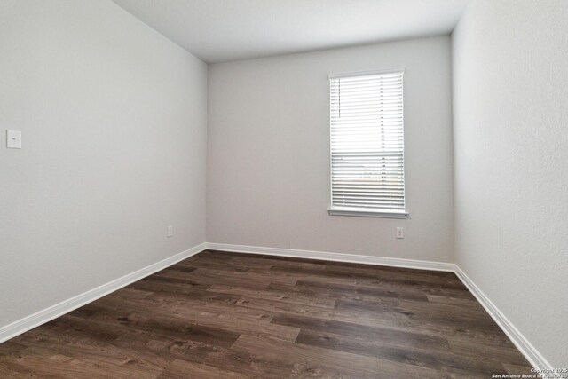 1619 Vista View Dr, Pleasanton, TX 78064 - unfurnished room featuring dark wood-style flooring and baseboards
