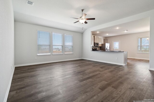 1619 Vista View Dr, Pleasanton, TX 78064 - unfurnished living room with ceiling fan and dark wood-type flooring
