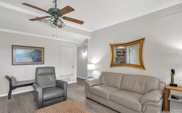 1819 Babcock Unit 605, San Antonio, TX 78229 - living room featuring wood finished floors, a ceiling fan, and crown molding