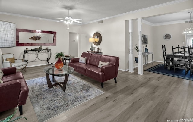 1819 Babcock Unit 605, San Antonio, TX 78229 - living area featuring ceiling fan, wood finished floors, ornamental molding, and a chandelier