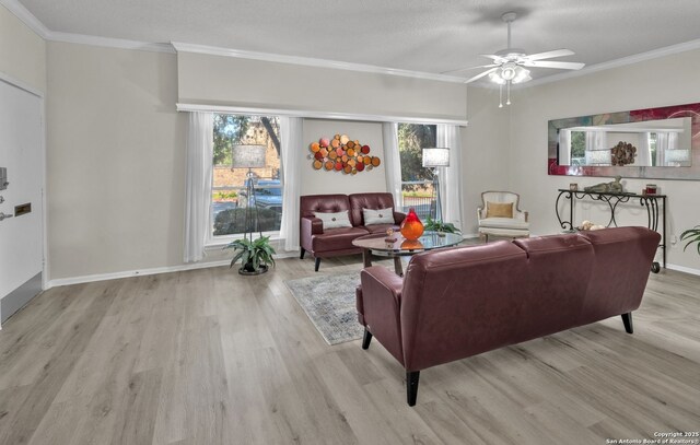 1819 Babcock Unit 605, San Antonio, TX 78229 - living room featuring wood finished floors, crown molding, and ceiling fan