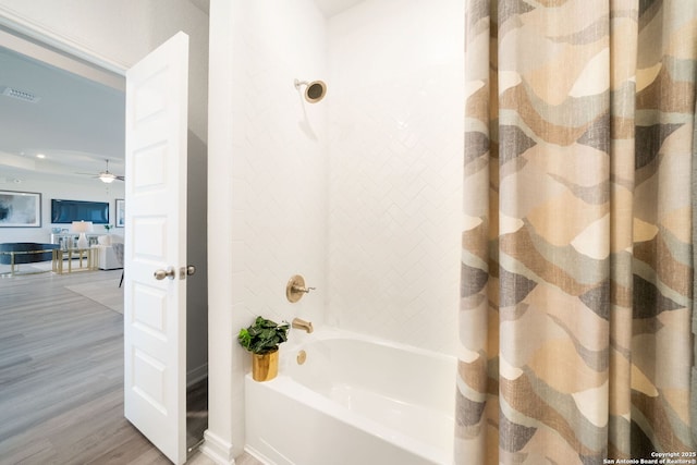1562 Vista View Dr, Pleasanton, TX 78064 - bathroom featuring shower / bath combo, wood finished floors, and a ceiling fan