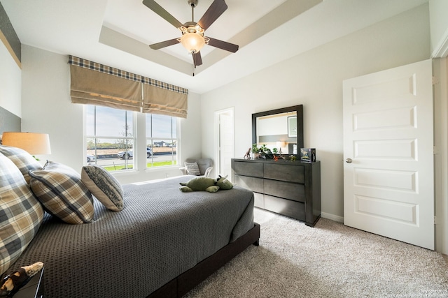 1562 Vista View Dr, Pleasanton, TX 78064 - carpeted bedroom featuring a raised ceiling and ceiling fan