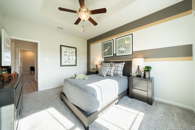 1562 Vista View Dr, Pleasanton, TX 78064 - bedroom with carpet flooring, a tray ceiling, and ceiling fan