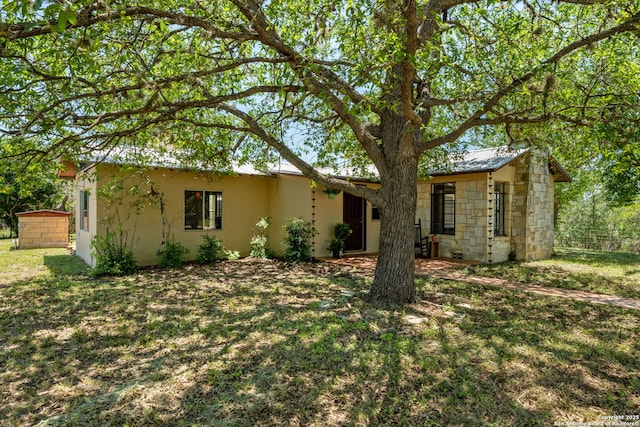 13132 State Highway 16, Medina, TX 78055 - ranch-style home with stucco siding, a front yard, and stone siding