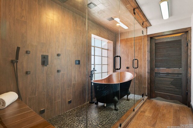 13132 State Highway 16, Medina, TX 78055 - full bathroom featuring a shower stall, a freestanding tub, and beamed ceiling