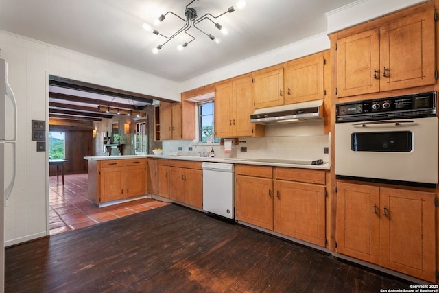 13132 State Highway 16, Medina, TX 78055 - kitchen featuring white appliances, under cabinet range hood, dark wood-style floors, and light countertops