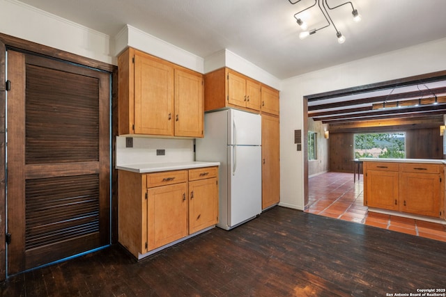 13132 State Highway 16, Medina, TX 78055 - kitchen with freestanding refrigerator, light countertops, dark wood-style floors, and crown molding