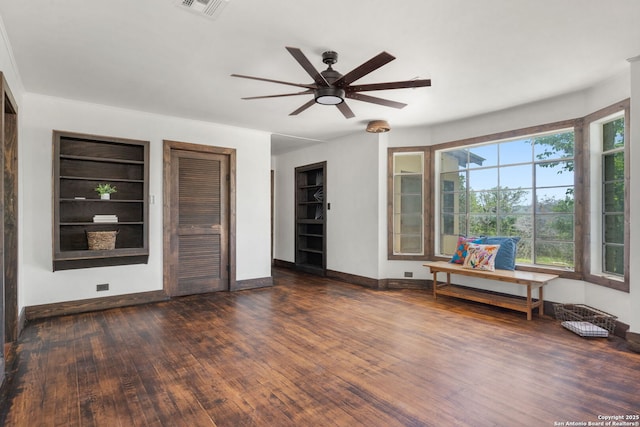 13132 State Highway 16, Medina, TX 78055 - unfurnished room with a ceiling fan, built in shelves, and wood finished floors