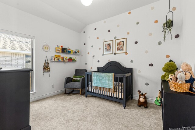 2604 Sueno Pt, San Antonio, TX 78245 - bedroom with light colored carpet, a nursery area, and lofted ceiling