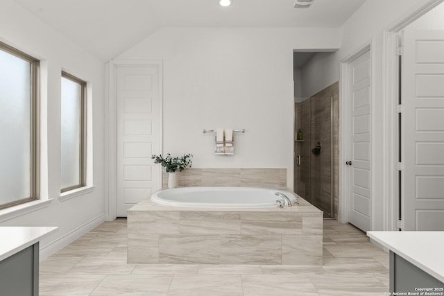 2604 Sueno Pt, San Antonio, TX 78245 - bathroom with vanity, a bath, healthy amount of natural light, a shower stall, and vaulted ceiling